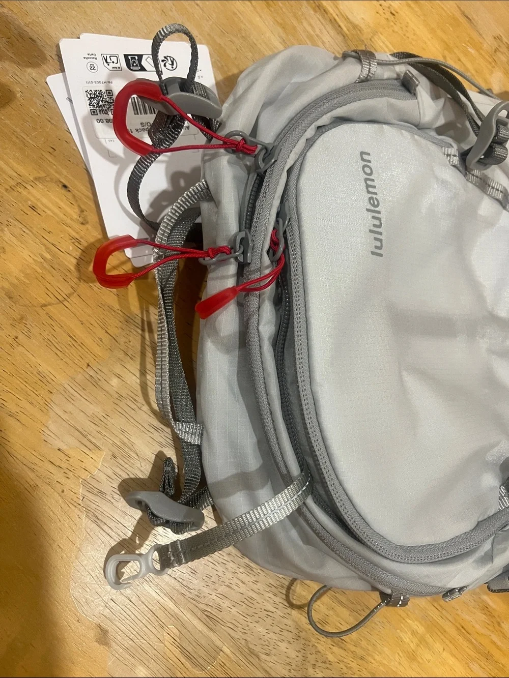 lululemon athletica Light Gray Men’s Hydration Backpack with Red Pull Tabs 10L